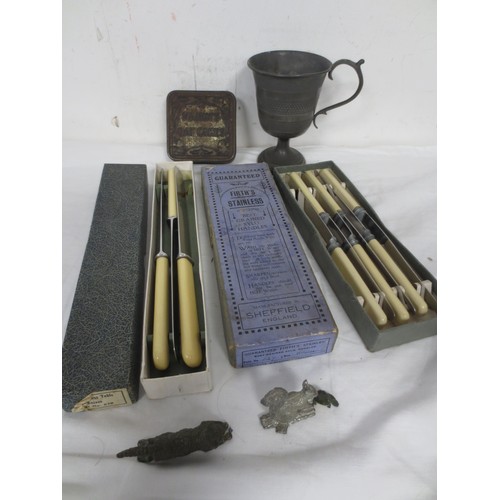 43 - An antique pewter goblet with handle and nicely dimpled finish, two sets of vintage knives, boxed an... 