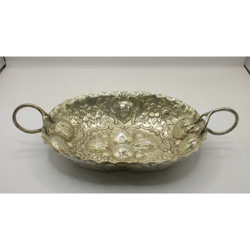 21 - An 800 white metal two-handled porringer type bowl, deeply embossed with fruit, flowers and shields.... 