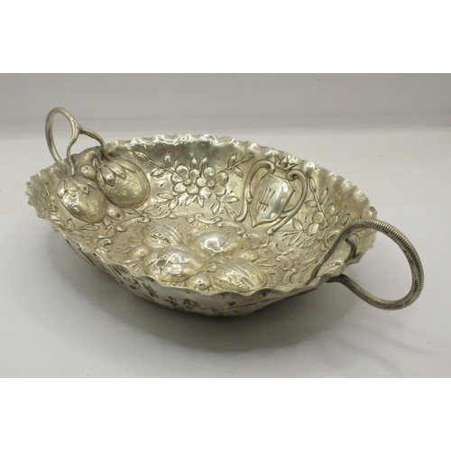21 - An 800 white metal two-handled porringer type bowl, deeply embossed with fruit, flowers and shields.... 