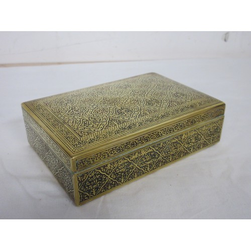 44 - Two heavy brass manillas, an engraved brass cigarette box marked Kinco, and a small brass bowl (diam... 