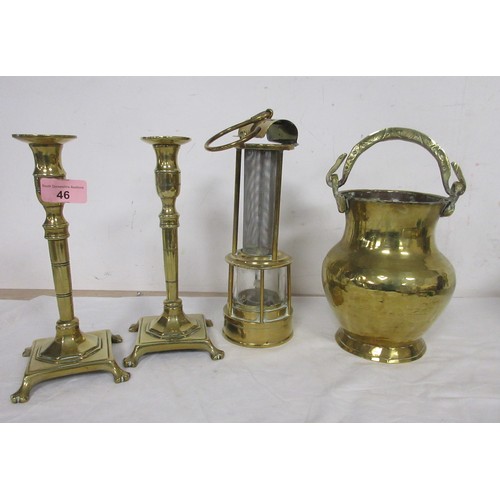 46 - A brass miner's type lamp, a brass vase with serpent handle, and a pair of brass candlesticks (23cm)