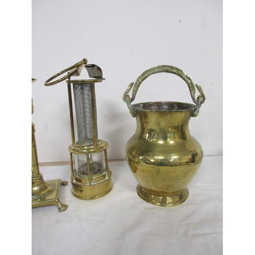 46 - A brass miner's type lamp, a brass vase with serpent handle, and a pair of brass candlesticks (23cm)