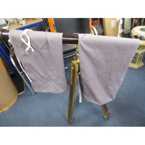 9 - A vintage leather bound brass telescope mounted upon a wood and brass tripod, with cover, in good ov... 