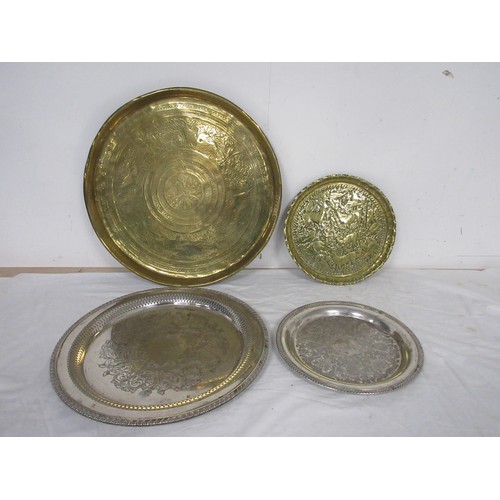 48 - An eastern circular brass tray engraved with lions and figures (diameter 43cm), a brass tray embosse... 