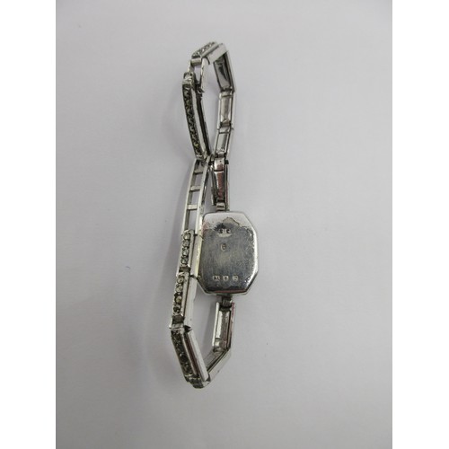 15 - A ladies silver cocktail wristwatch set with marcasite to the case and bracelet. The back of the cas... 