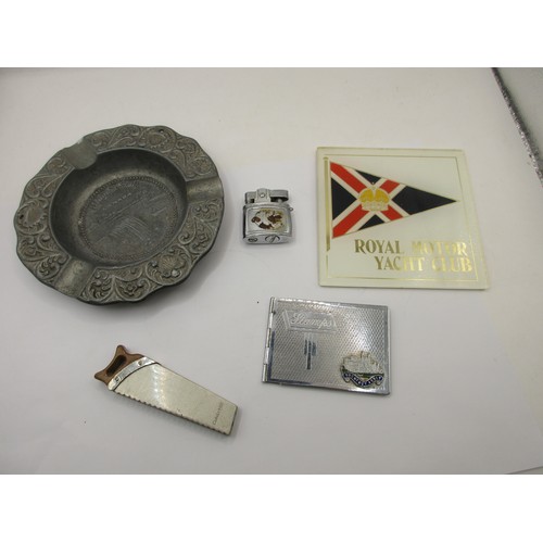 18 - A Calvin Hill cigarette lighter shaped as a saw, a Dragon Manufacturing Pacific cigarette lighter,  ... 