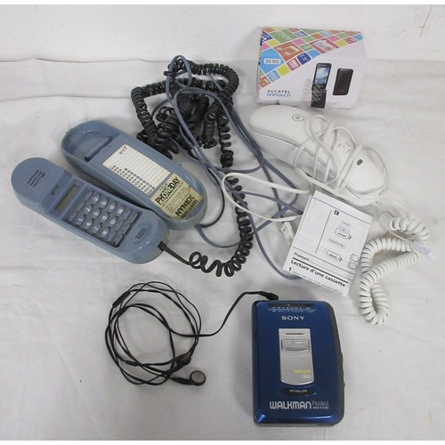 31 - A Sony Walkman model WM-FX181 with headphones, a pair of vintage BT telephone and a boxed mobile pho... 