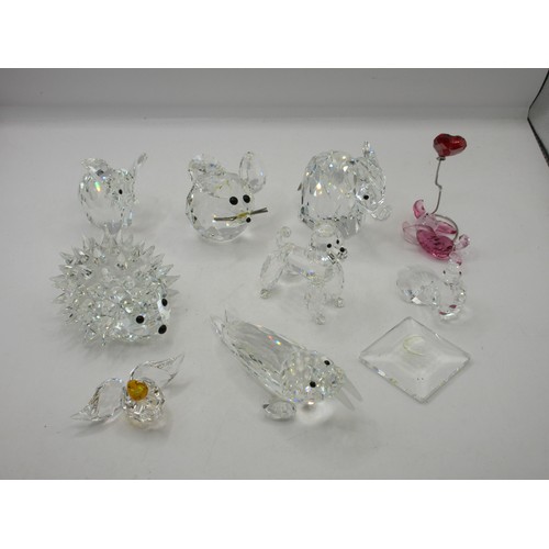 22 - A selection of Swarovski animal figures including a pair o elephants, hedgehog, walrus, poodle, bird... 