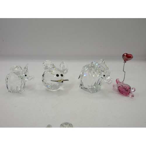 22 - A selection of Swarovski animal figures including a pair o elephants, hedgehog, walrus, poodle, bird... 