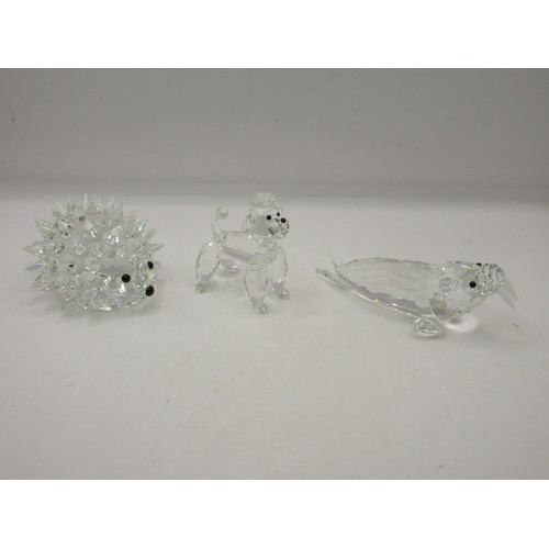 22 - A selection of Swarovski animal figures including a pair o elephants, hedgehog, walrus, poodle, bird... 