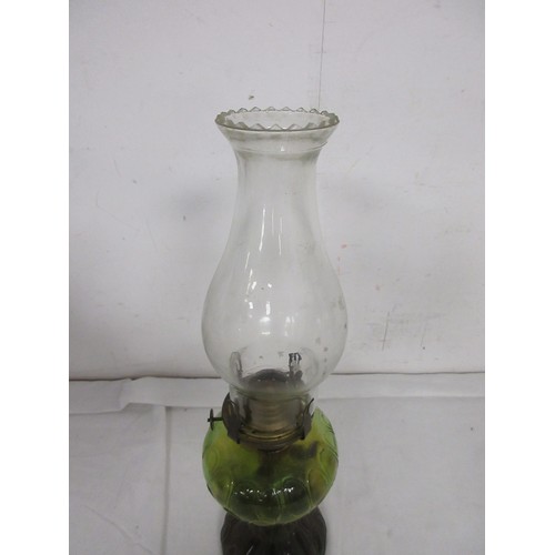 25 - An antique glass oil lamp with glass funnel