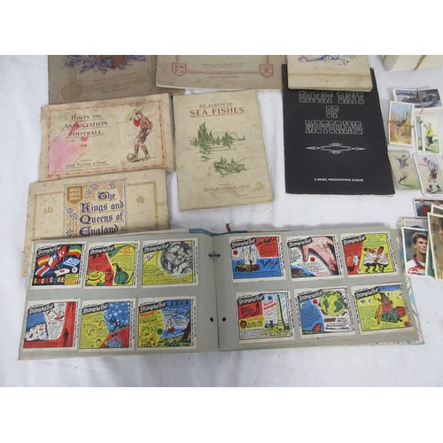 36 - A selection of both mounted and unmounted cigarette cards along with some other collectors cards in ... 