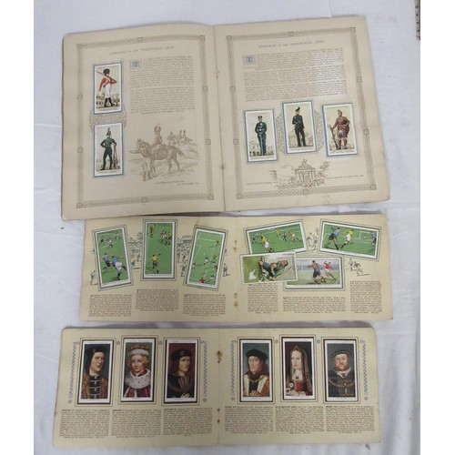36 - A selection of both mounted and unmounted cigarette cards along with some other collectors cards in ... 