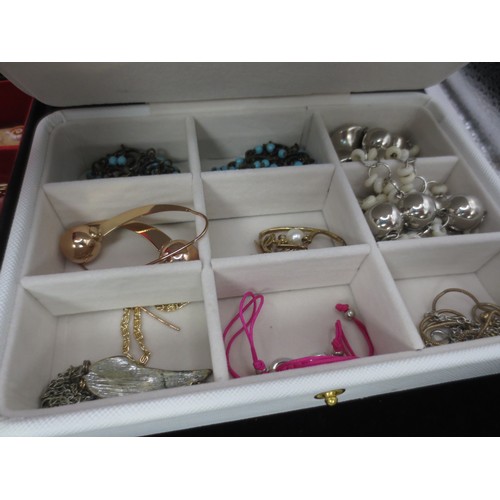 58 - Costume jewellery contained in a white fabric-clad jewellery box, and a fabric-clad jewellery box em... 