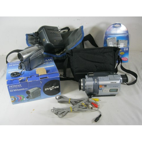 69 - Three video cameras with some accessories - a Panasonic VHS-C Movie Camera NV-S1 with a woven nylon ... 