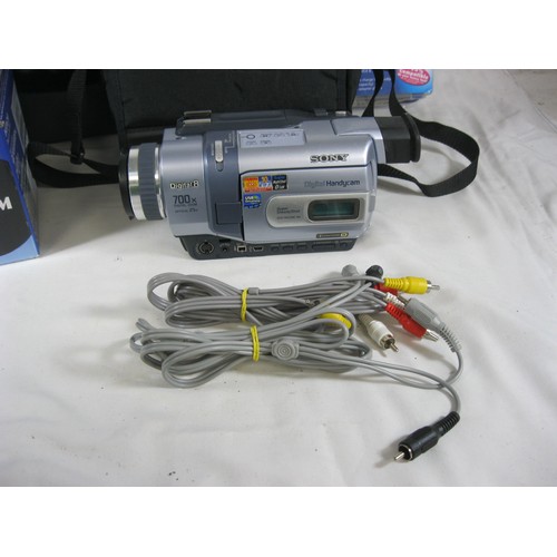 69 - Three video cameras with some accessories - a Panasonic VHS-C Movie Camera NV-S1 with a woven nylon ... 