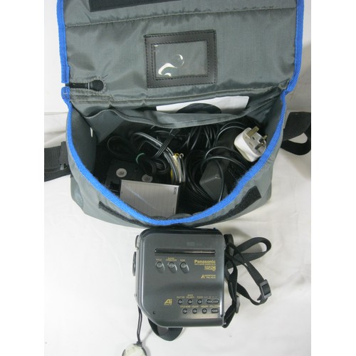 69 - Three video cameras with some accessories - a Panasonic VHS-C Movie Camera NV-S1 with a woven nylon ... 