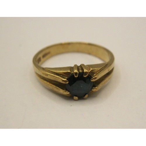 3 - A 9 carat gold ring set with a blue stone, likely sapphire, in very good order, halllmarked, approx ... 
