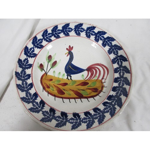 129 - An antique Swansea Pottery cockerel plate, hand painted, in good order