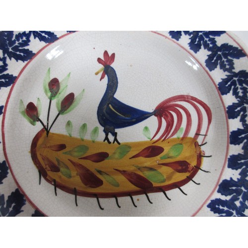 129 - An antique Swansea Pottery cockerel plate, hand painted, in good order