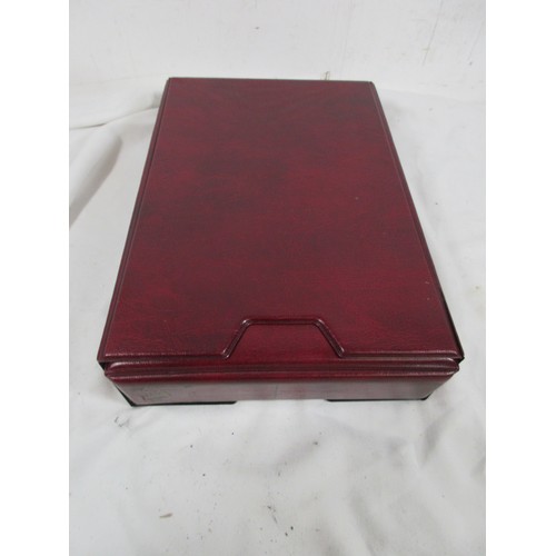 145 - A cigarette card collectors album in matching slip case containing a quantity of empty plastic card ... 