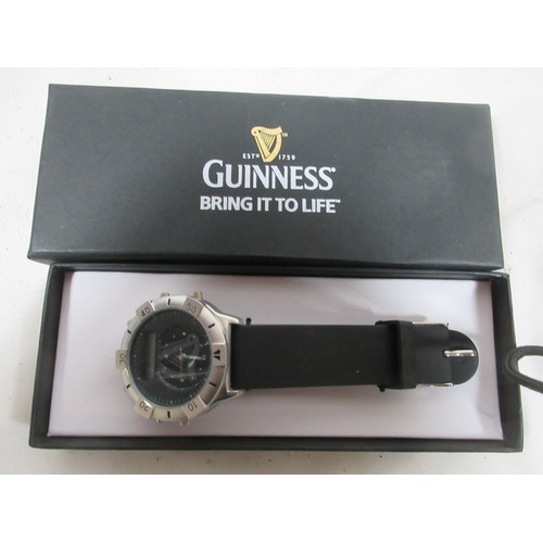 147 - A Guinness branded wristwatch in original packaging, appears unused, requires battery plus a 007 bra... 