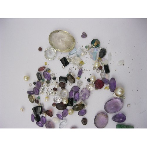 68 - A small bag of assorted precious and semi-precious stones of varying colours and sizes