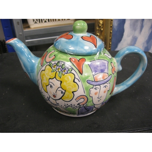 179 - A lovely hand painted teapot by the welch artist Kate Clanville with a couple getting married .Has b... 