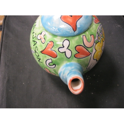 179 - A lovely hand painted teapot by the welch artist Kate Clanville with a couple getting married .Has b... 
