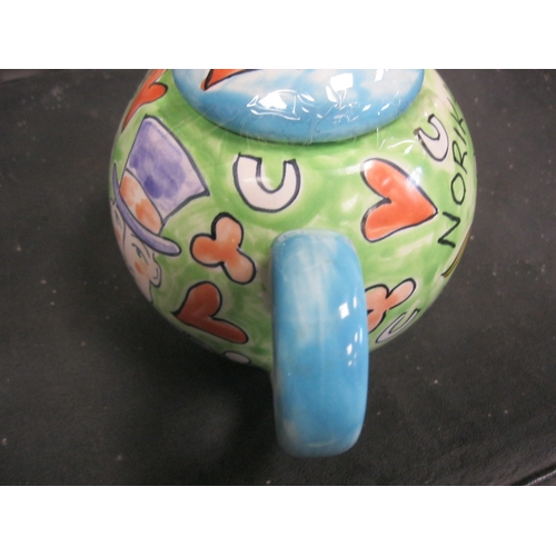 179 - A lovely hand painted teapot by the welch artist Kate Clanville with a couple getting married .Has b... 