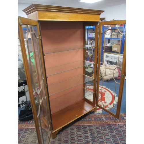 169 - A tall glazed display cabinet somewhat art deco in design, with glass shelves, key present, in very ... 
