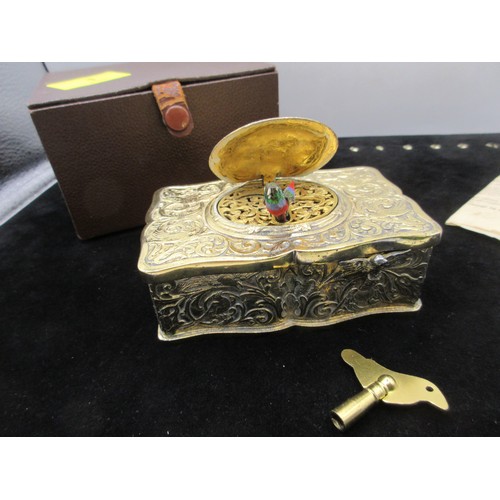 A likely early 20th century automata music box with singing bird figure ...