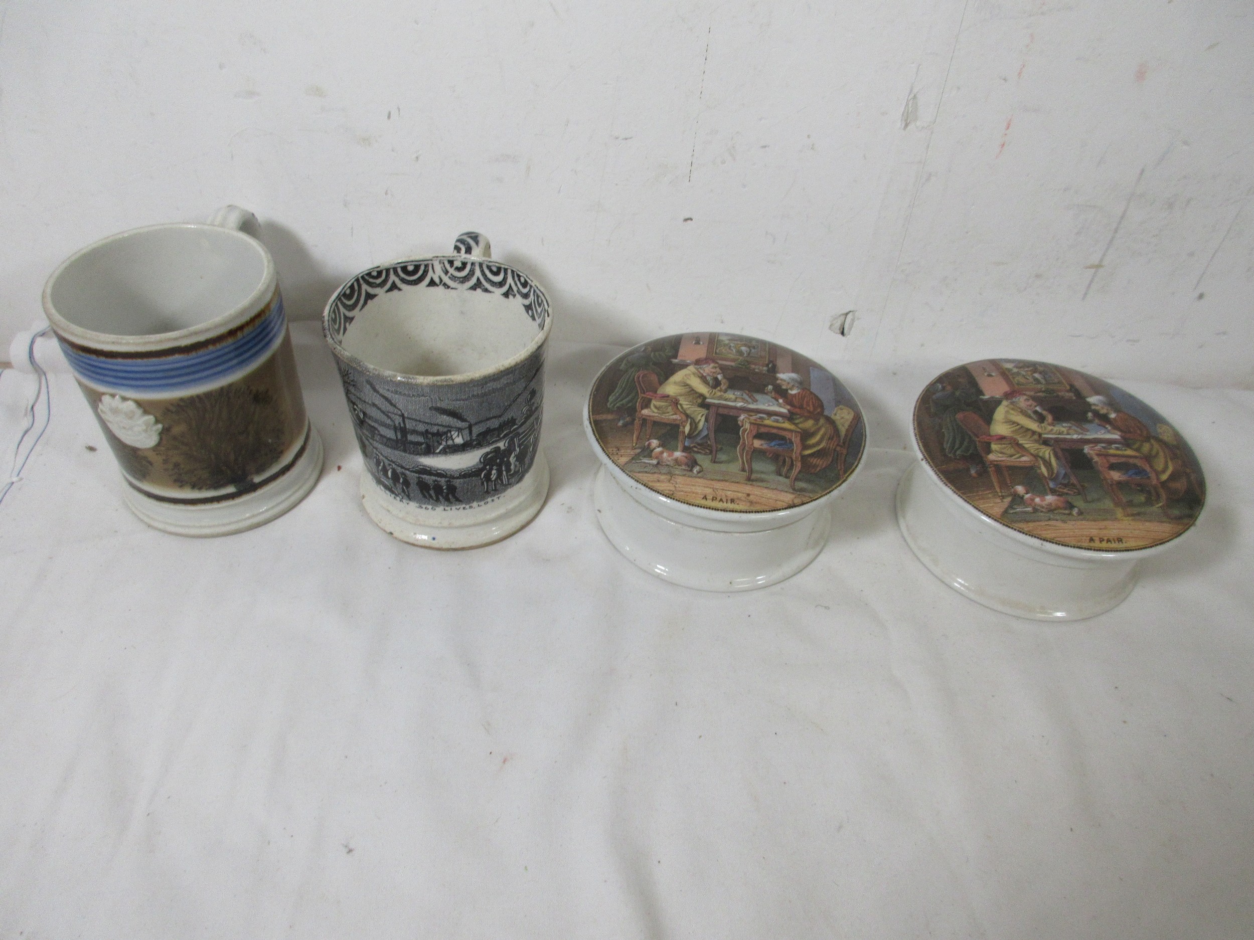 An Oaks Colliery disaster of 1866 commemorative pottery mug, together ...