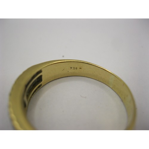 1 - An 18 carat gold ring with a distinctive setting of twenty baguette cut diamonds between two rows of... 