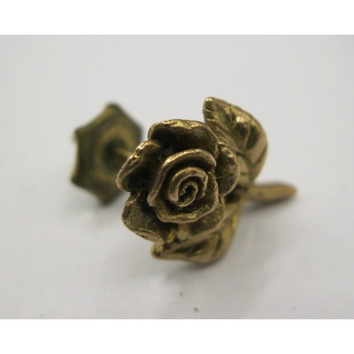 8 - A 9 carat gold rose stem lapel pin,  approx. 1.2g, stamped 9 375.  With a base metal retainer.