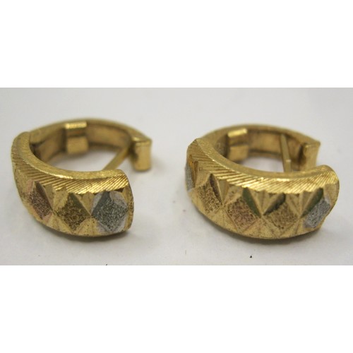 13 - A pair of 18 carat foreign gold earrings, of hinged open loop form, two-tone, with geometric facetin... 