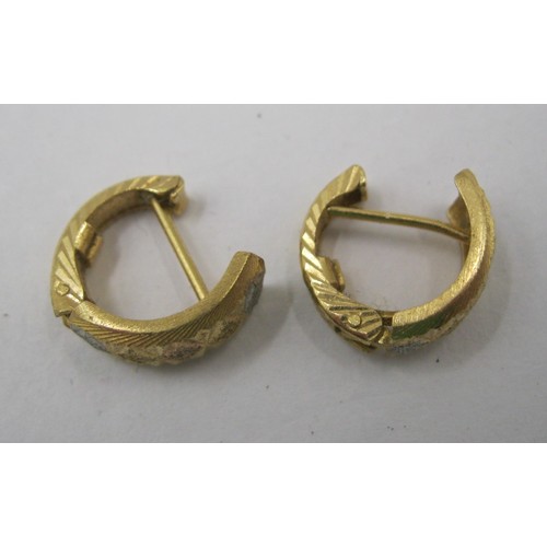 13 - A pair of 18 carat foreign gold earrings, of hinged open loop form, two-tone, with geometric facetin... 