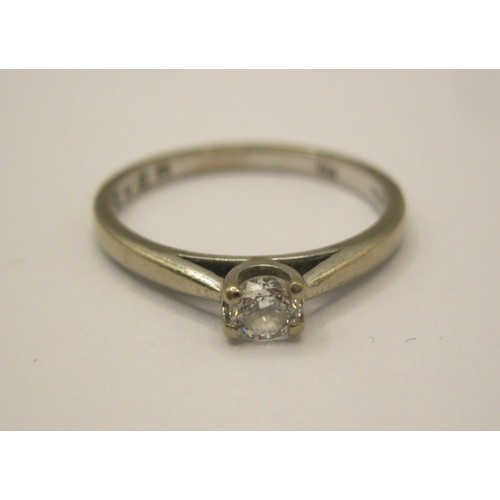 17 - An 18 carat imported white gold solitaire diamond ring,  the diamond 0.20 carat, with a Jewellery Id... 