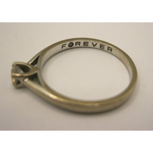 17 - An 18 carat imported white gold solitaire diamond ring,  the diamond 0.20 carat, with a Jewellery Id... 