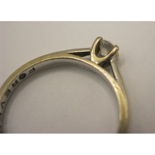 17 - An 18 carat imported white gold solitaire diamond ring,  the diamond 0.20 carat, with a Jewellery Id... 