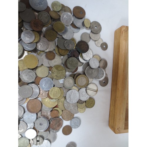 53 - Assorted world coins contained in a wooden box including some silver