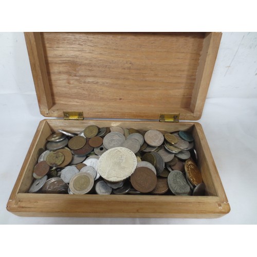 53 - Assorted world coins contained in a wooden box including some silver