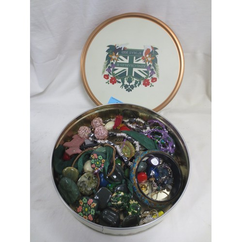 42 - A tin of costume jewellery large beaded necklaces