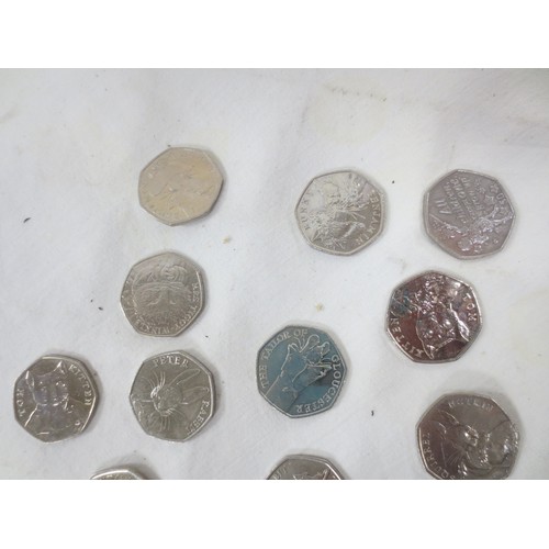 44 - Twelve 2016 and 2017 Beatrix Potter 50 pence coins, and one Isle of Man 50 pence coin Peter Pan All ... 