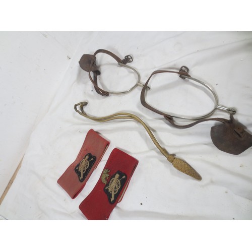 50 - A pair of Royal Artillery armbands and a pair of officer's spurs, one armband with the elephant divi... 