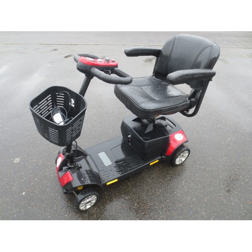 47 - A mobility scooter with charger and handbook, in working order