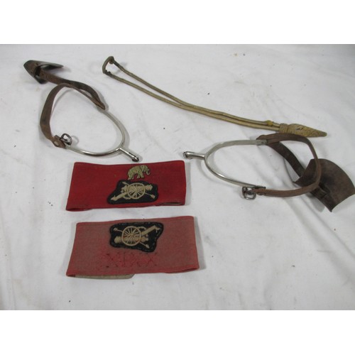 50 - A pair of Royal Artillery armbands and a pair of officer's spurs, one armband with the elephant divi... 