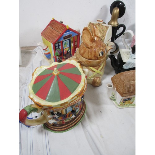 27 - A selection of Novelty teapots including a Cockrell all as per pictures