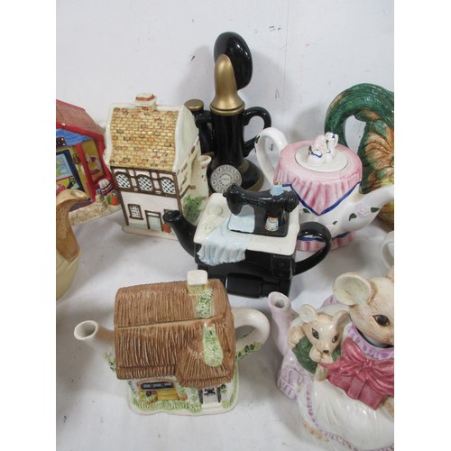 27 - A selection of Novelty teapots including a Cockrell all as per pictures