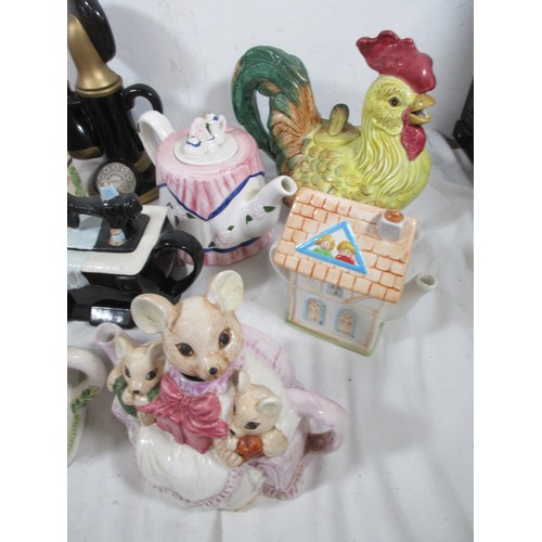 27 - A selection of Novelty teapots including a Cockrell all as per pictures